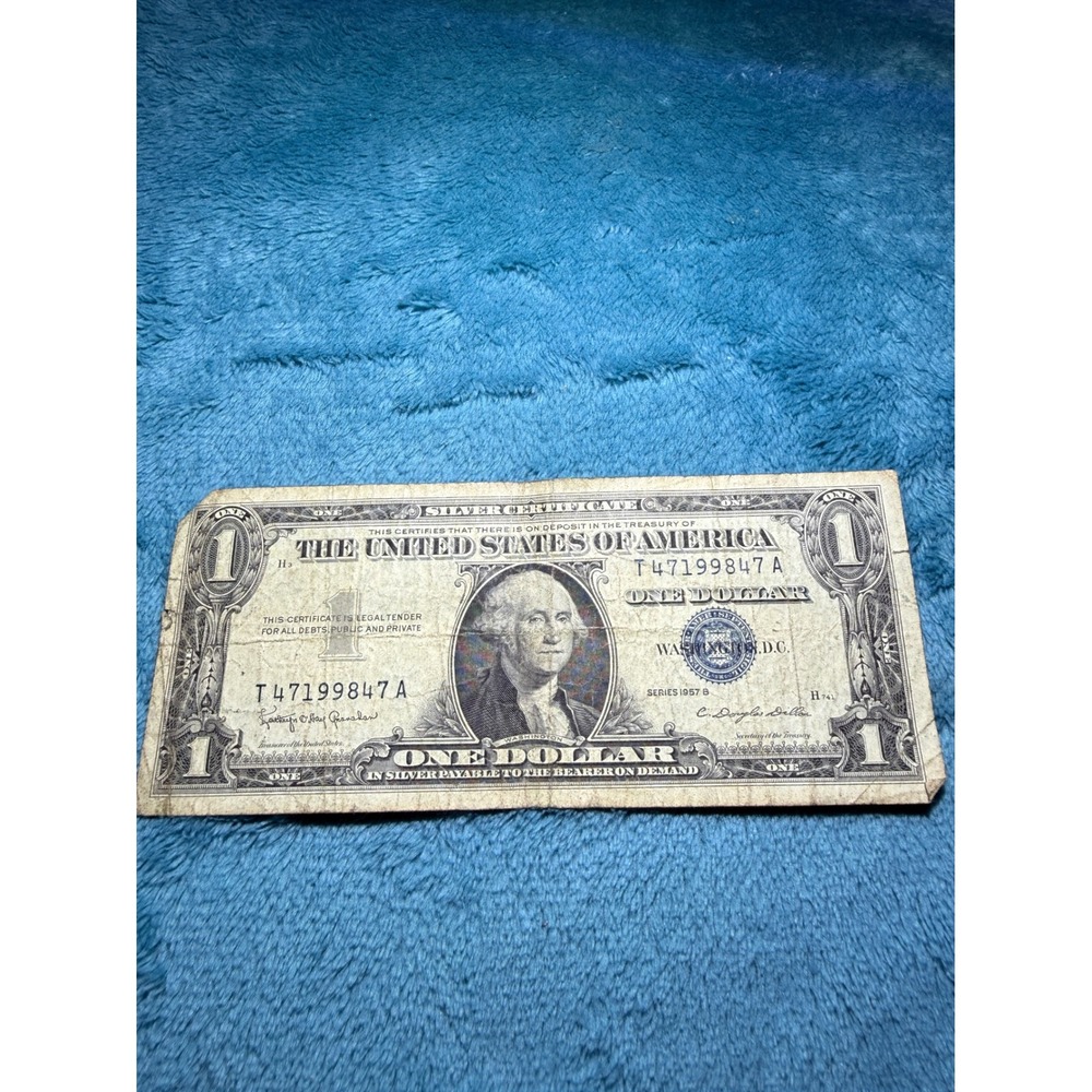 1957A ONE DOLLAR BLUE SEAL SILVER CERTIFICATE NOT CENTERED UNEVEN BORDERS